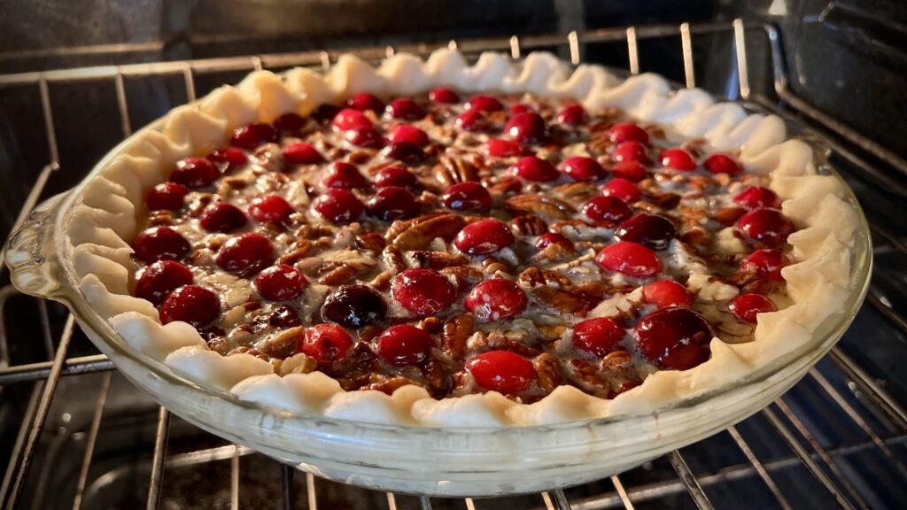 Cranberry Pecan Pie in the oven